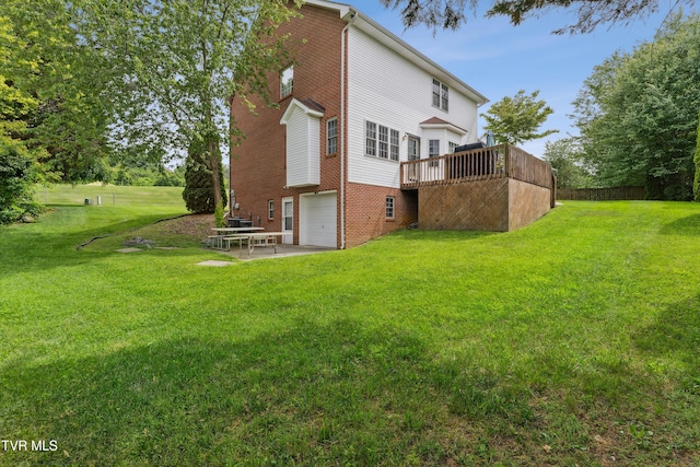 1402 Lake Ridge Sq, Johnson City, TN 37601 - back of property featuring a wooden deck, brick siding, a garage, and a lawn