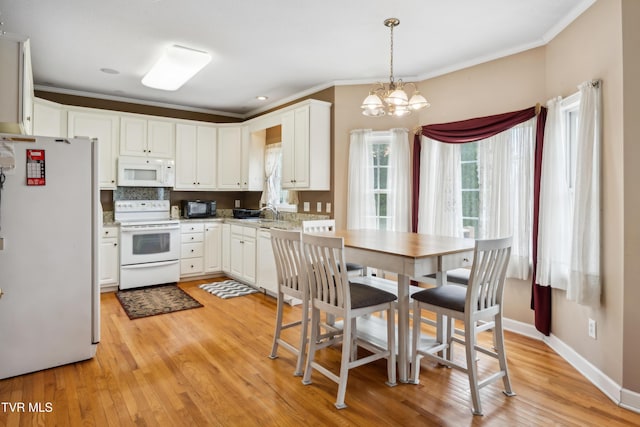 1402 Lake Ridge Sq, Johnson City, TN 37601 - kitchen featuring white appliances, ornamental molding, a chandelier, light wood-style flooring, and white cabinets