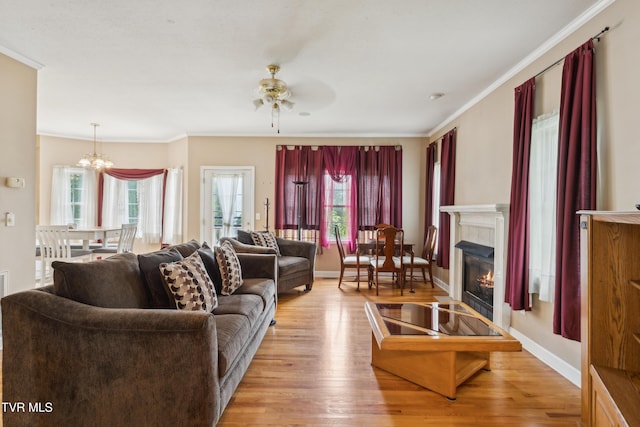 1402 Lake Ridge Sq, Johnson City, TN 37601 - living area featuring ceiling fan, a glass covered fireplace, plenty of natural light, wood finished floors, and ornamental molding
