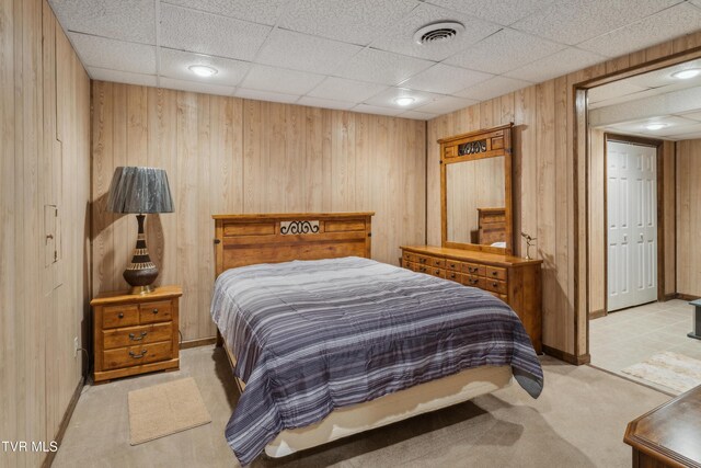 1402 Lake Ridge Sq, Johnson City, TN 37601 - bedroom with light carpet, wooden walls, baseboards, and a paneled ceiling