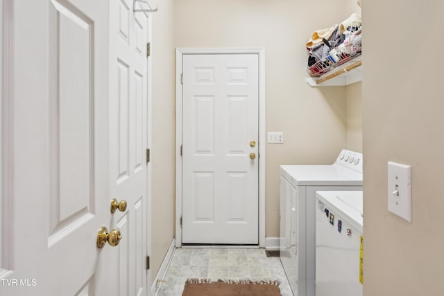 1402 Lake Ridge Sq, Johnson City, TN 37601 - washroom with washer and clothes dryer and baseboards