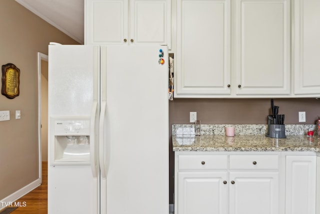 1402 Lake Ridge Sq, Johnson City, TN 37601 - kitchen featuring white refrigerator with ice dispenser, white cabinetry, wood finished floors, and light stone counters