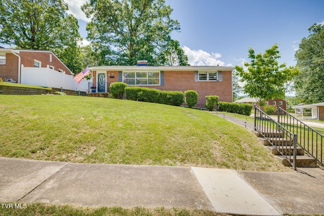 2228 Bruce St, Kingsport, TN 37664 - view of front facade with brick siding and a chimney
