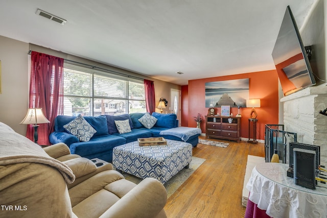 2228 Bruce St, Kingsport, TN 37664 - living area with wood finished floors, a fireplace, and baseboards