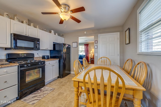 2228 Bruce St, Kingsport, TN 37664 - kitchen featuring black appliances, white cabinetry, a ceiling fan, and light stone countertops