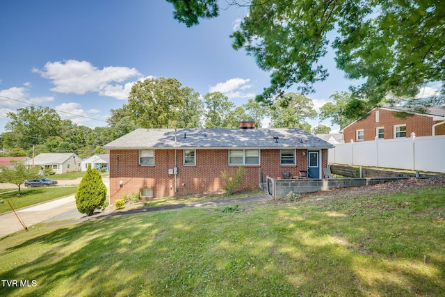 2228 Bruce St, Kingsport, TN 37664 - back of house with brick siding, a chimney, and central AC unit