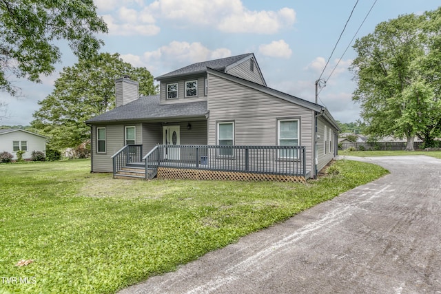 5 Loire Ct, Johnson City, TN 37604 - view of front of house with a chimney, a front yard, a shingled roof, and a porch