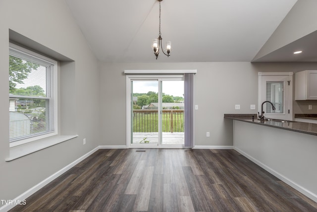 5 Loire Ct, Johnson City, TN 37604 - unfurnished dining area featuring vaulted ceiling, a sink, dark wood-type flooring, plenty of natural light, and a chandelier