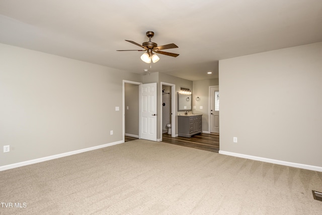 5 Loire Ct, Johnson City, TN 37604 - unfurnished bedroom with dark carpet, baseboards, connected bathroom, recessed lighting, and a sink