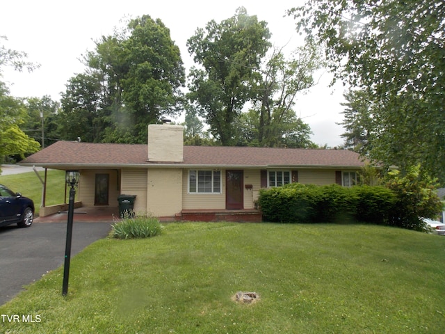 167 Cherry Ln, Bristol, VA 24201 - single story home with a carport, a front lawn, asphalt driveway, and a chimney