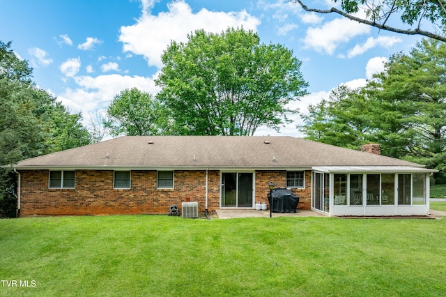 293 Miller Rd, Jonesborough, TN 37659 - back of property featuring central AC unit, a sunroom, a patio, a chimney, and brick siding