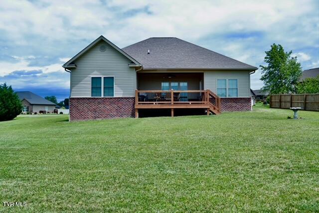 110 Rhetts Way, Jonesborough, TN 37659 - rear view of house with a lawn, a deck, and brick siding