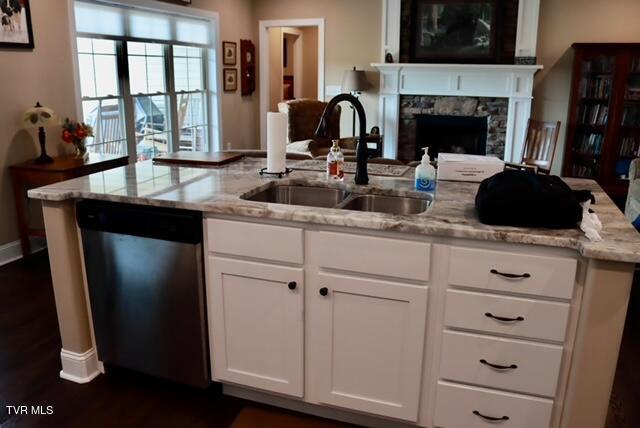 110 Rhetts Way, Jonesborough, TN 37659 - kitchen featuring stainless steel dishwasher, a sink, open floor plan, and light stone countertops