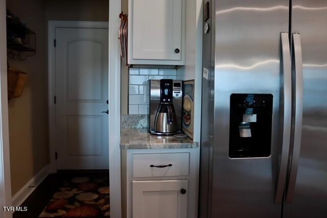 110 Rhetts Way, Jonesborough, TN 37659 - kitchen with stainless steel fridge, white cabinetry, light stone countertops, decorative backsplash, and baseboards
