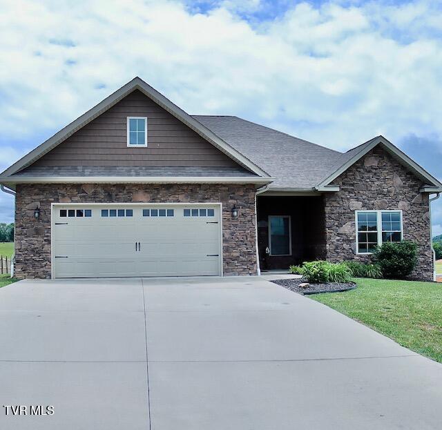 110 Rhetts Way, Jonesborough, TN 37659 - view of front of home featuring stone siding, driveway, an attached garage, and a front yard