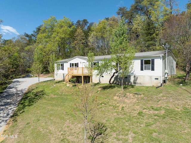 123 Griffin Dr, Dandridge, TN 37725 - manufactured / mobile home with a front yard, a wooden deck, crawl space, and metal roof