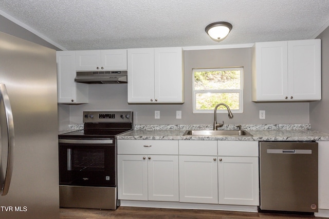 123 Griffin Dr, Dandridge, TN 37725 - kitchen featuring appliances with stainless steel finishes, under cabinet range hood, a sink, a textured ceiling, and white cabinetry