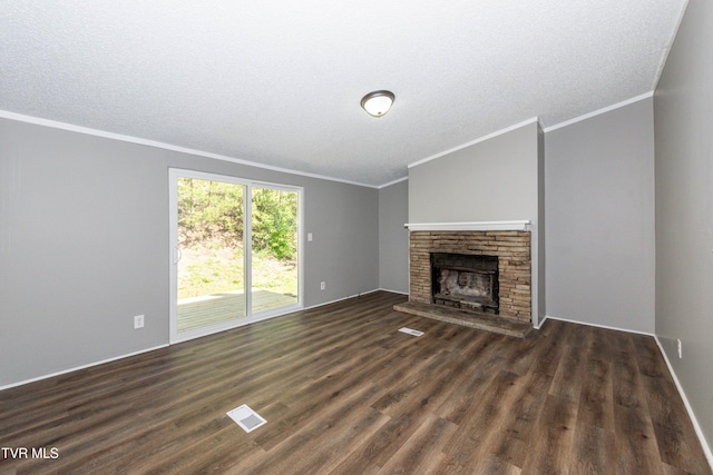 123 Griffin Dr, Dandridge, TN 37725 - unfurnished living room featuring crown molding, dark wood-style flooring, a fireplace, and a textured ceiling