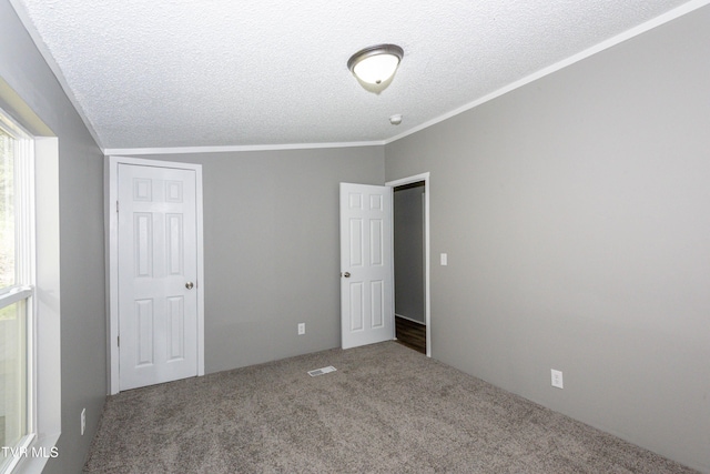 123 Griffin Dr, Dandridge, TN 37725 - unfurnished bedroom with carpet floors, a textured ceiling, multiple windows, and crown molding