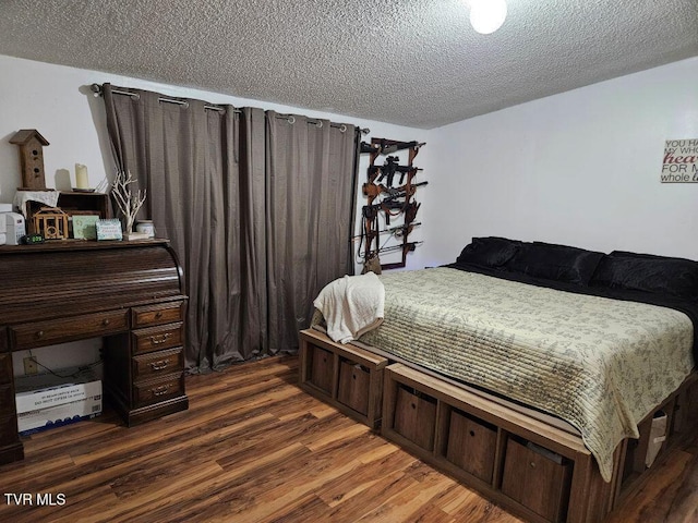 17508 Dreamers Ln, Glade Spring, VA 24340 - bedroom featuring a textured ceiling and dark wood-style flooring