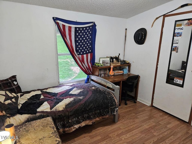 17508 Dreamers Ln, Glade Spring, VA 24340 - bedroom with wood finished floors and a textured ceiling