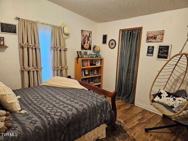 17508 Dreamers Ln, Glade Spring, VA 24340 - bedroom with wood finished floors, baseboards, and a textured ceiling