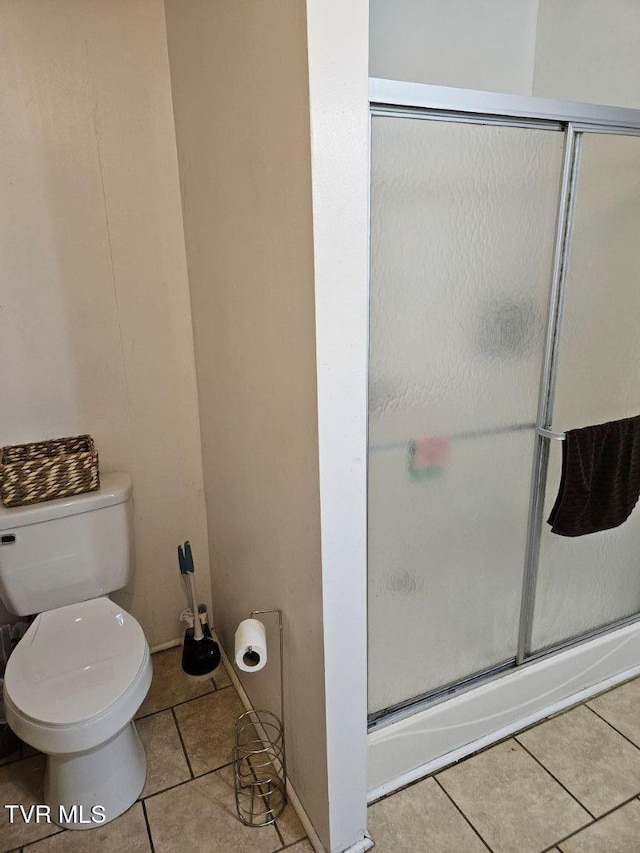 17508 Dreamers Ln, Glade Spring, VA 24340 - bathroom with tile patterned flooring, toilet, and a shower with door