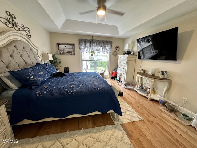 59 Whisper Bnd Unit 0, Johnson City, TN 37604 - bedroom featuring a raised ceiling, wood finished floors, and ceiling fan