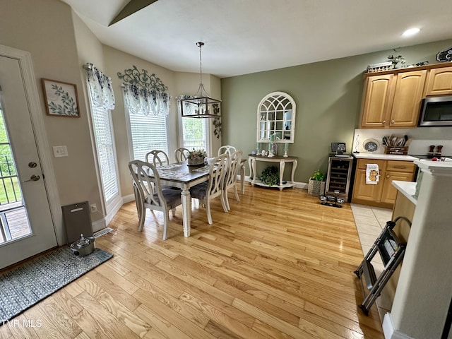 59 Whisper Bnd Unit 0, Johnson City, TN 37604 - dining area with light wood finished floors, baseboards, and wine cooler