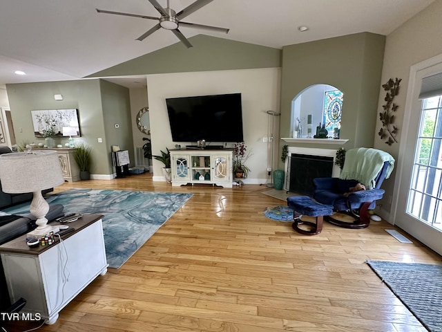 59 Whisper Bnd Unit 0, Johnson City, TN 37604 - living area featuring a ceiling fan, wood-type flooring, vaulted ceiling, a fireplace with flush hearth, and baseboards