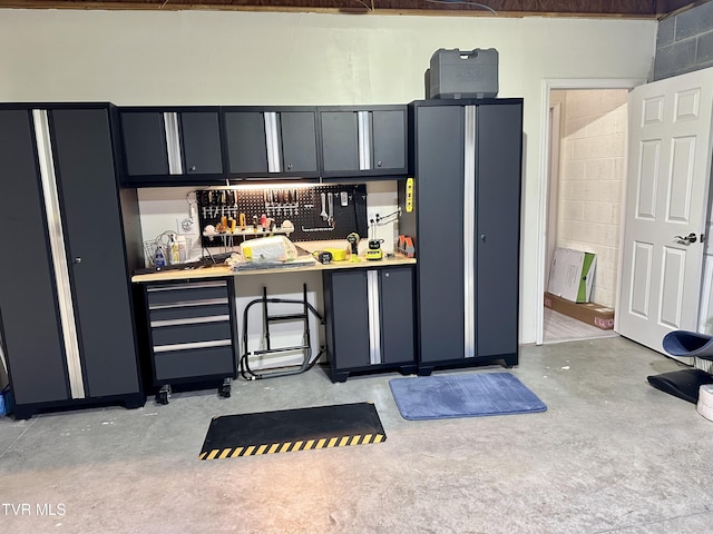 59 Whisper Bnd Unit 0, Johnson City, TN 37604 - kitchen featuring concrete flooring, light countertops, and concrete block wall
