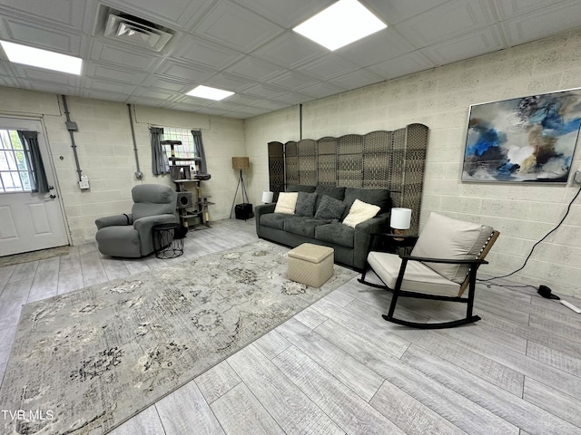 59 Whisper Bnd Unit 0, Johnson City, TN 37604 - living area with healthy amount of natural light, wood finished floors, and concrete block wall