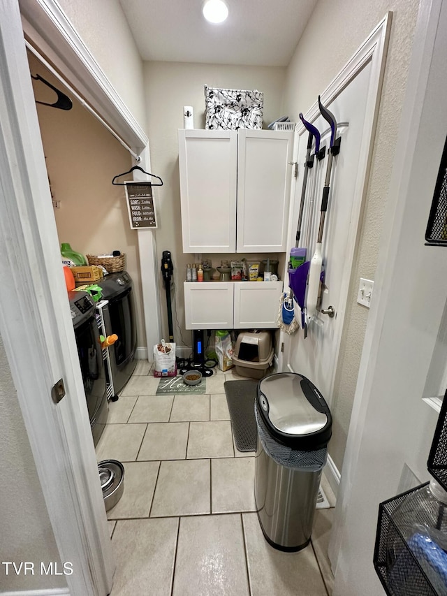 59 Whisper Bnd Unit 0, Johnson City, TN 37604 - washroom with washer / clothes dryer, light tile patterned floors, and baseboards