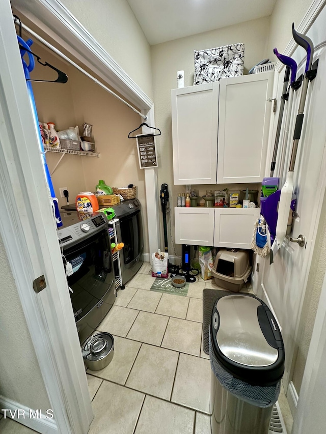 59 Whisper Bnd Unit 0, Johnson City, TN 37604 - laundry area with washer and dryer, light tile patterned floors, baseboards, and cabinet space