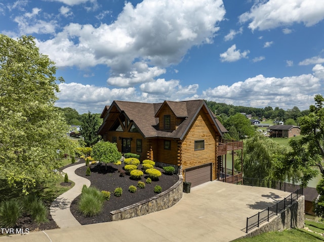 455 Boring Chapel Rd, Johnson City, TN 37615 - log cabin with log siding, concrete driveway, and an attached garage