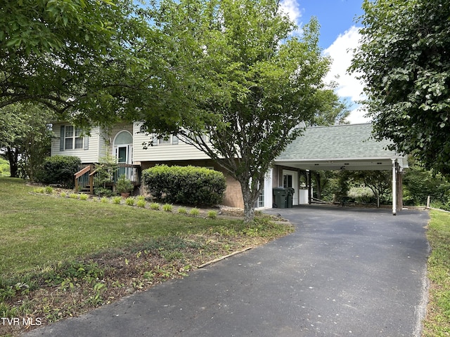 115 Butterfly Ct, Limestone, TN 37681 - view of front of property with a front lawn, asphalt driveway, brick siding, and an attached carport