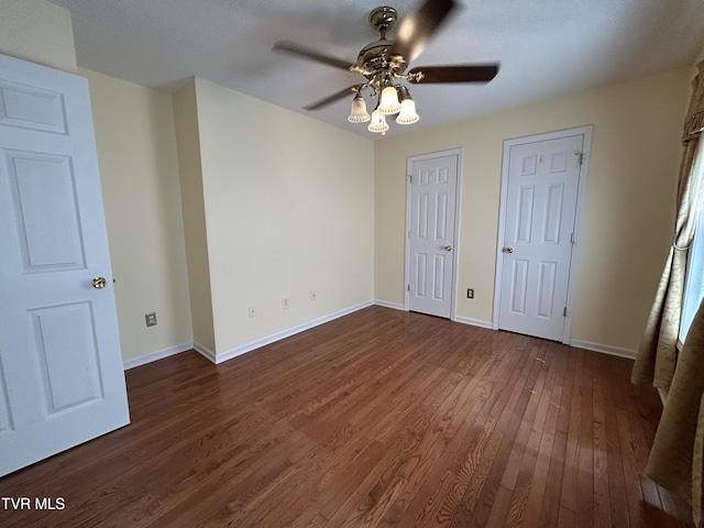 115 Butterfly Ct, Limestone, TN 37681 - unfurnished bedroom with dark wood finished floors, baseboards, and a ceiling fan