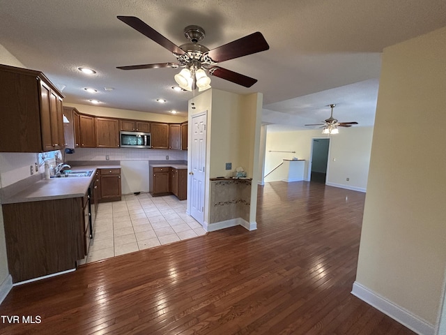 115 Butterfly Ct, Limestone, TN 37681 - kitchen with stainless steel microwave, light wood-style flooring, a ceiling fan, and recessed lighting