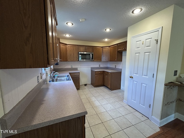 115 Butterfly Ct, Limestone, TN 37681 - kitchen featuring stainless steel microwave, a sink, a textured ceiling, light tile patterned floors, and recessed lighting