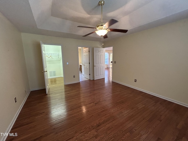 115 Butterfly Ct, Limestone, TN 37681 - unfurnished bedroom featuring wood finished floors, baseboards, a raised ceiling, and a ceiling fan