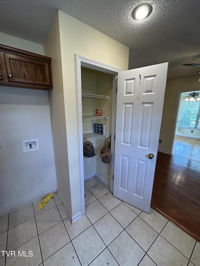 115 Butterfly Ct, Limestone, TN 37681 - washroom featuring washer hookup, light tile patterned flooring, a textured ceiling, ceiling fan, and baseboards
