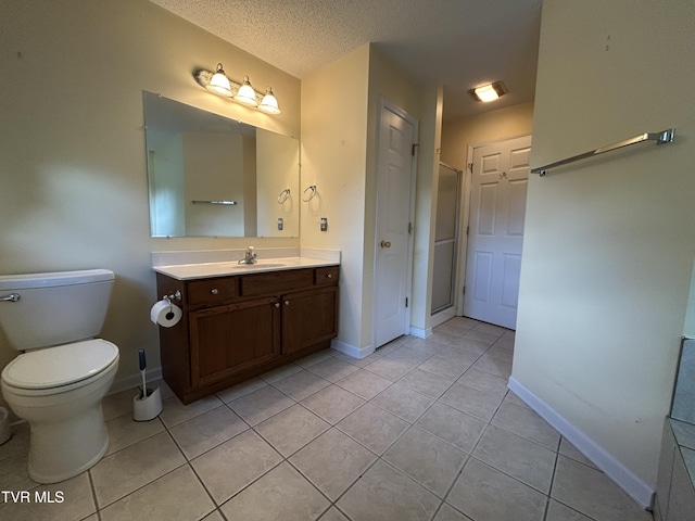 115 Butterfly Ct, Limestone, TN 37681 - bathroom featuring vanity, tile patterned floors, baseboards, an enclosed shower, and toilet