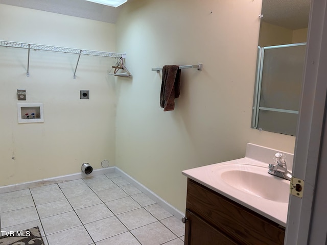 115 Butterfly Ct, Limestone, TN 37681 - washroom with hookup for an electric dryer, a sink, hookup for a washing machine, light tile patterned floors, and baseboards