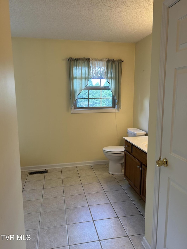 115 Butterfly Ct, Limestone, TN 37681 - bathroom with vanity, toilet, tile patterned flooring, a textured ceiling, and baseboards