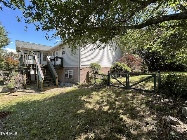 115 Butterfly Ct, Limestone, TN 37681 - view of property exterior with a gate, stairway, a wooden deck, and brick siding