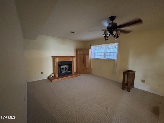 115 Butterfly Ct, Limestone, TN 37681 - unfurnished living room with ceiling fan, a fireplace with raised hearth, light carpet, and baseboards