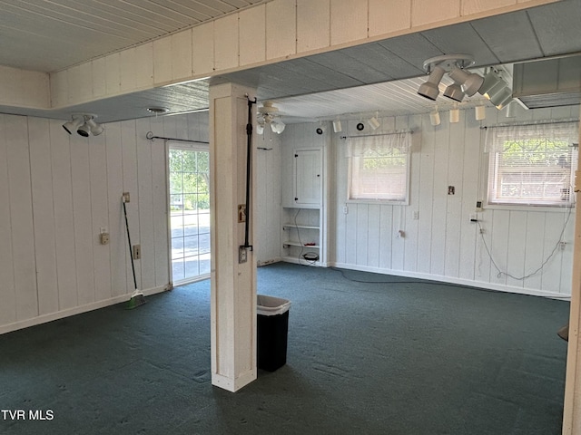 115 Butterfly Ct, Limestone, TN 37681 - interior space featuring dark carpet, wood walls, and baseboards