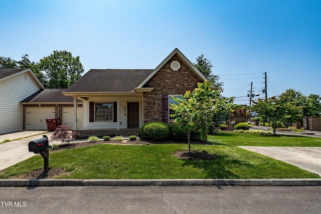 1010 Appaloosa Trl, Johnson City, TN 37604 - view of front of property with a garage, a front yard, concrete driveway, and stone siding