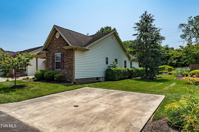 1010 Appaloosa Trl, Johnson City, TN 37604 - view of home's exterior with stone siding, a lawn, and a shingled roof
