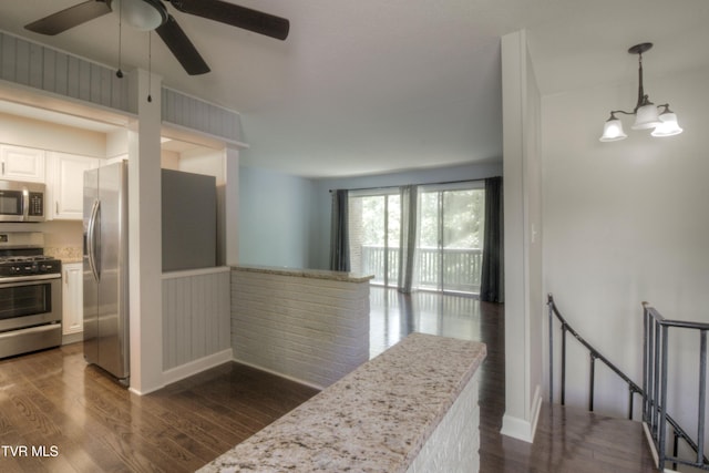 361 Belmont Dr Unit 14, Bristol, TN 37620 - kitchen with appliances with stainless steel finishes, dark wood-type flooring, white cabinets, ceiling fan, and a wainscoted wall
